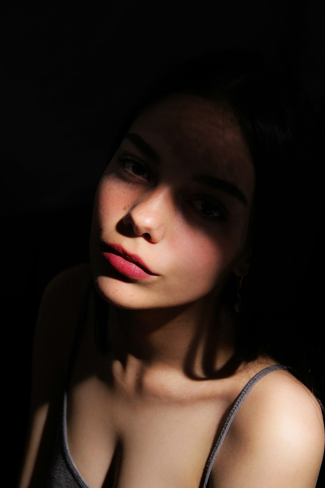 a-woman-in-a-tank-top-posing-for-a-picture-998qz7c6vug